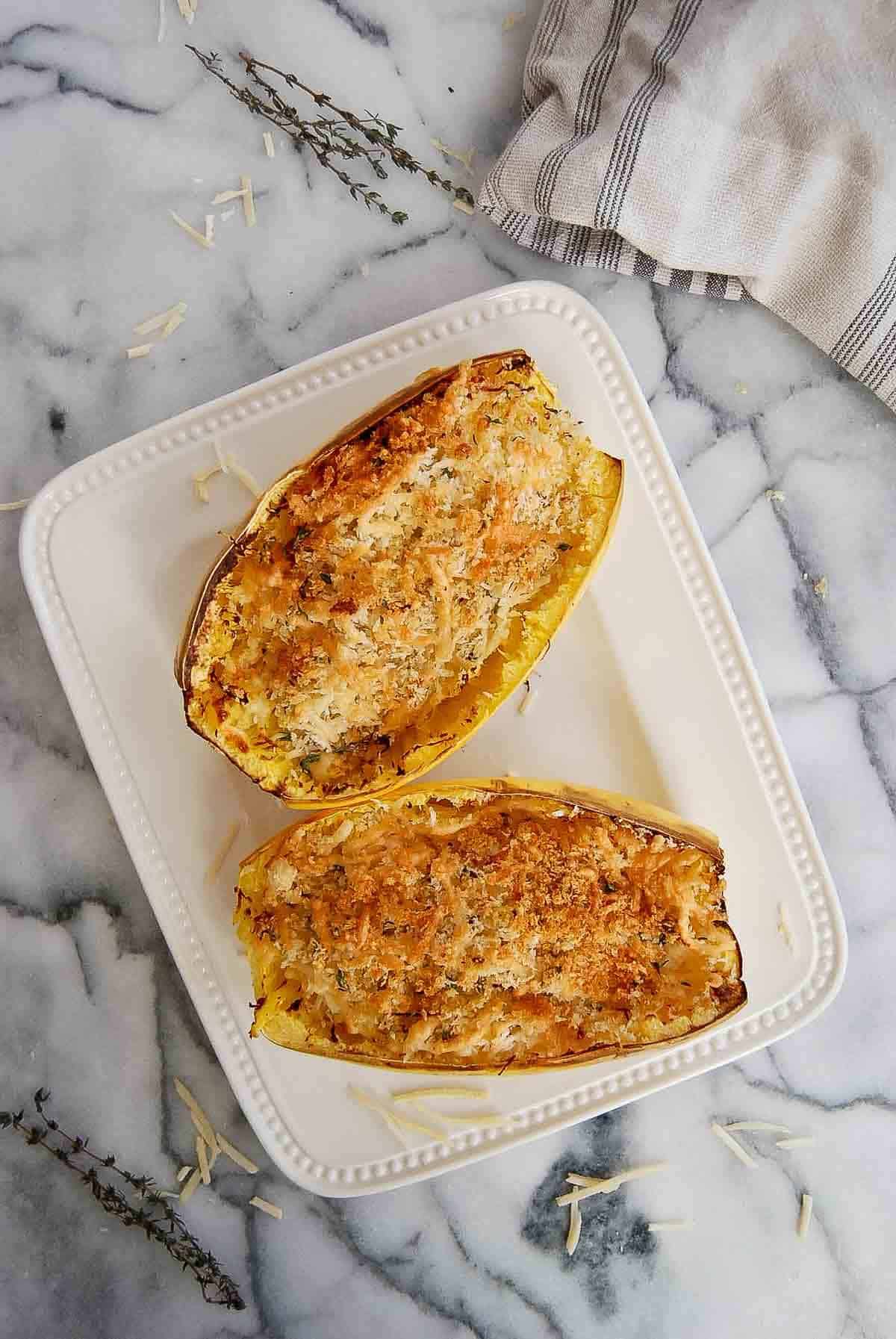 air fryer spaghetti squash with toasted cheese and breadcrumbs on top.