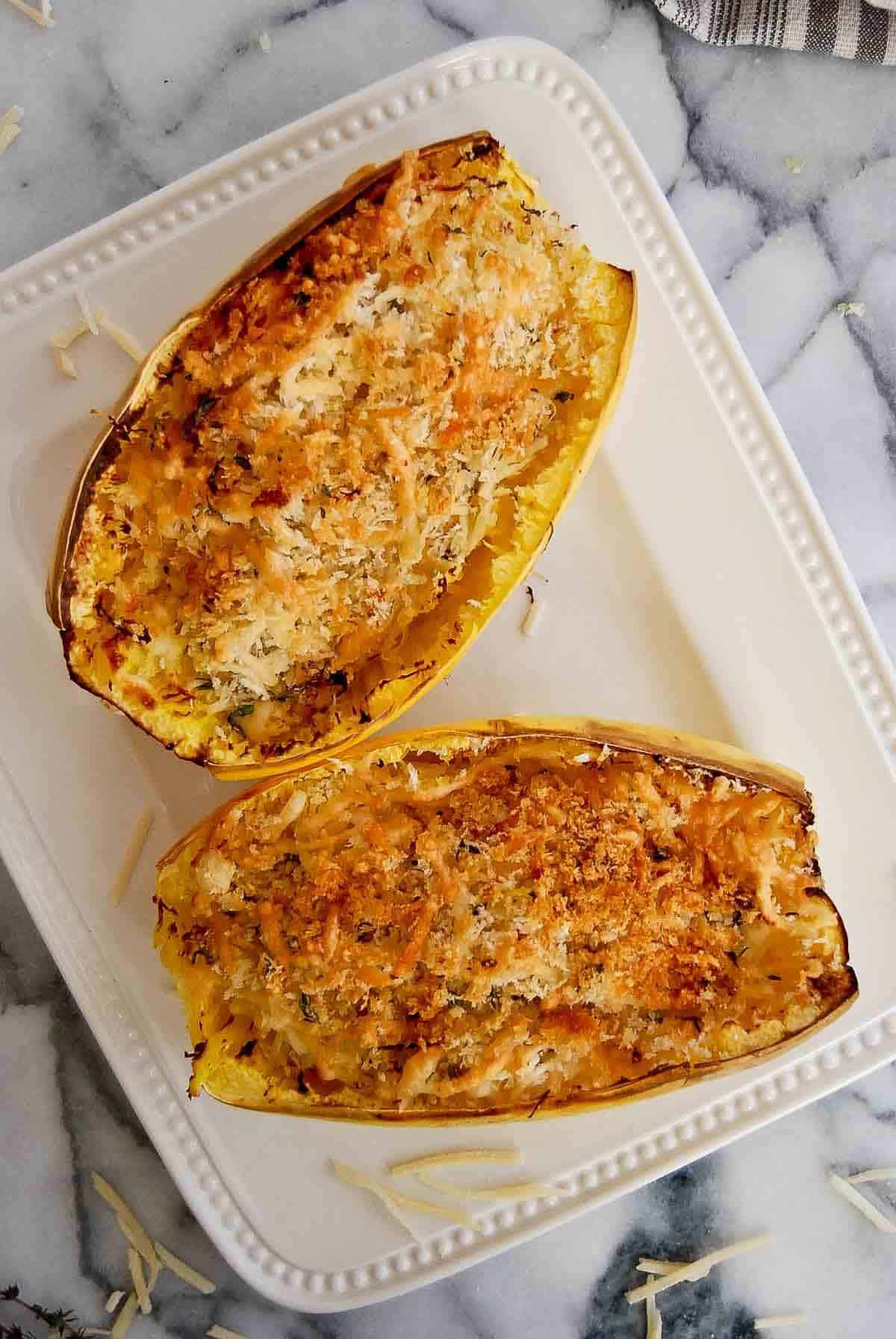 air fryer spaghetti squash with toasted cheese and breadcrumbs on top.