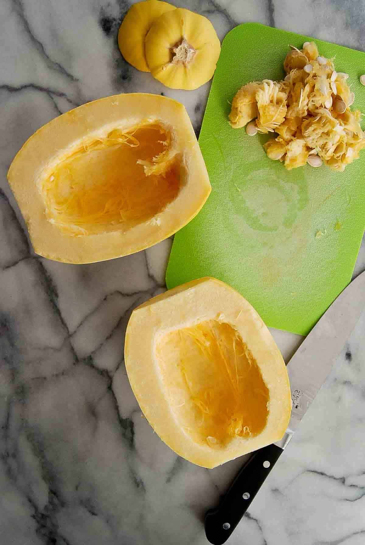 spaghetti squash sliced in half with seeds removed.