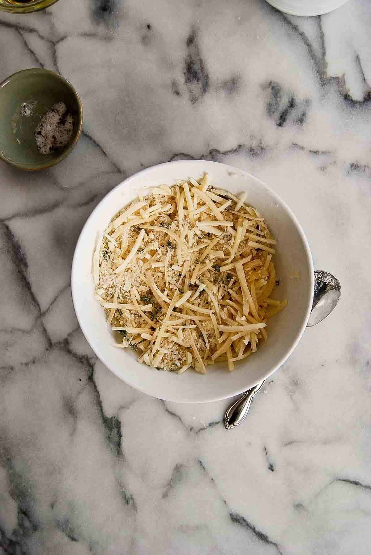 mixture of panko breadcrumbs, spices and cheese in bowl.