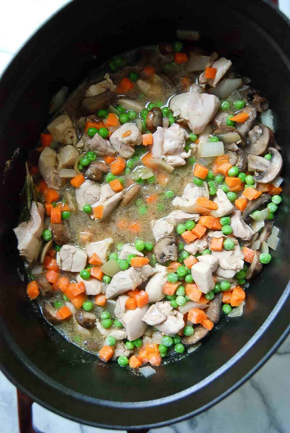 sauce for chicken cobbler in dutch oven, cooking.
