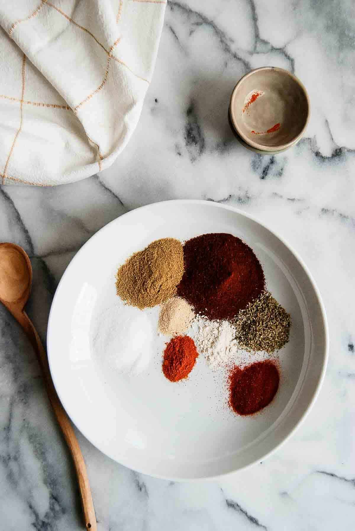 bowl filled with spices for chicken taco seasoning.