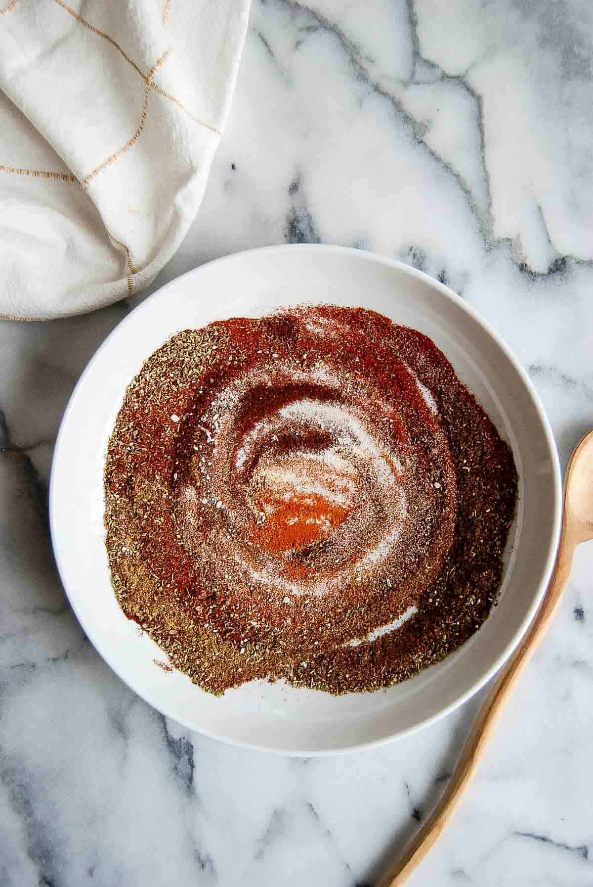 seasoning for chicken tacos swirled in a bowl on countertop.