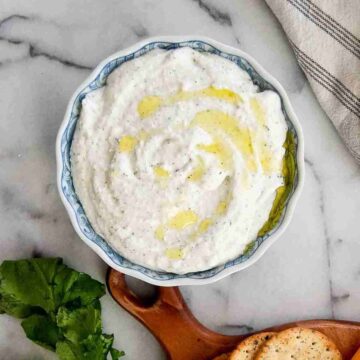 cottage cheese ranch dip in bowl drizzled with olive oil.