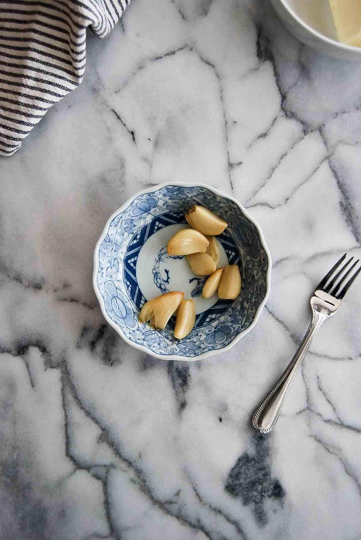 roasted garlic cloves in bowl.