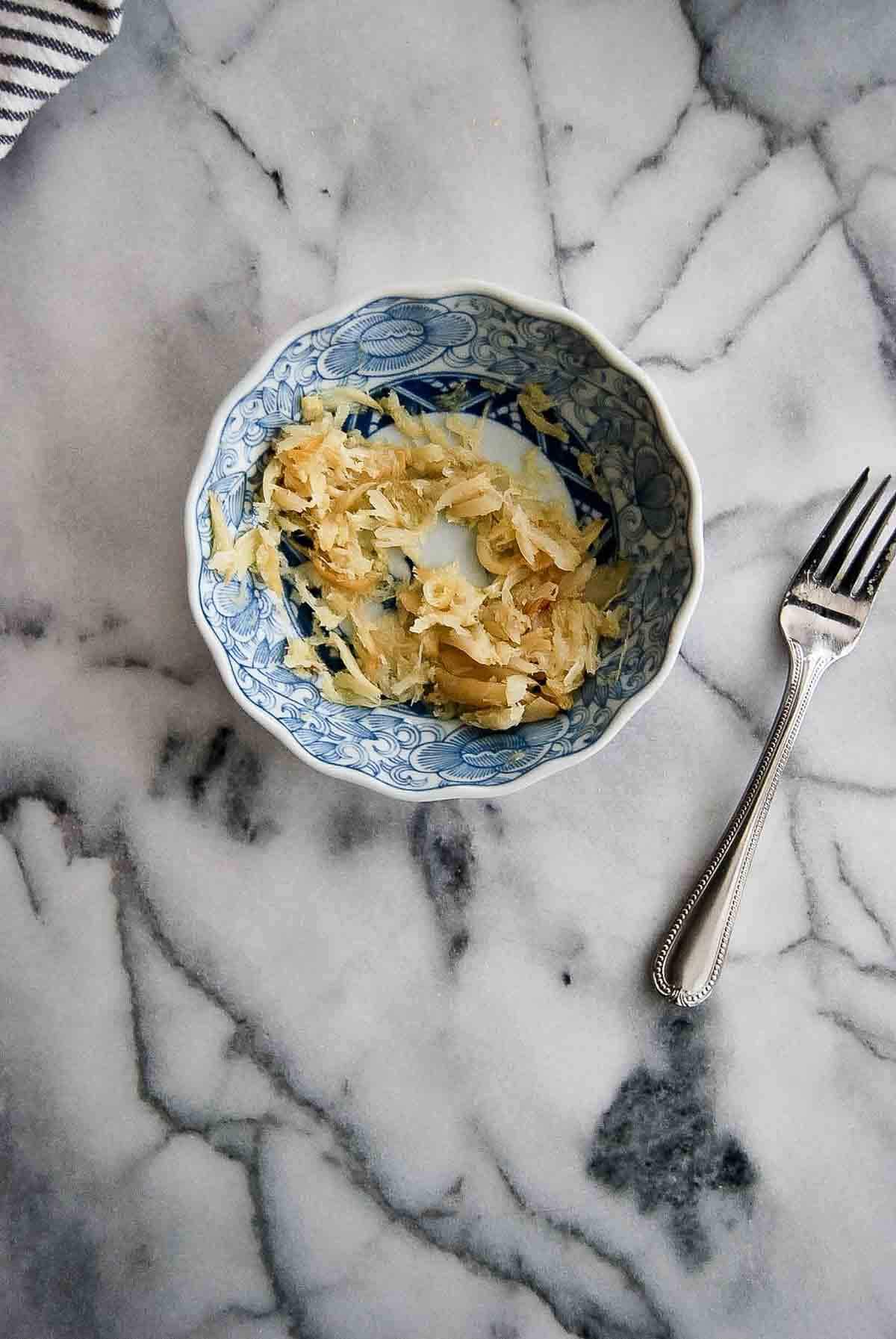 roasted garlic, mashed in bowl.