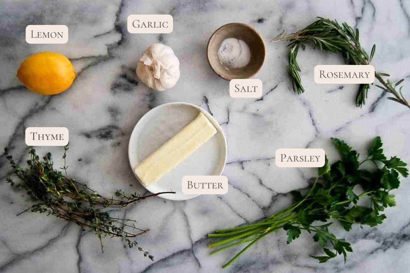 ingredients for roasted garlic butter seasoning on countertop.