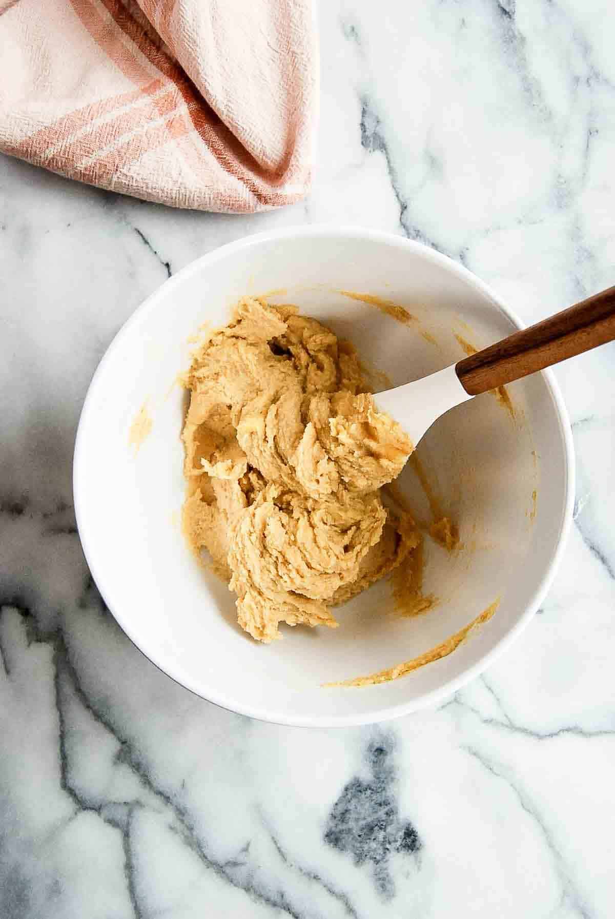 butter and sugars creamed together in a bowl.