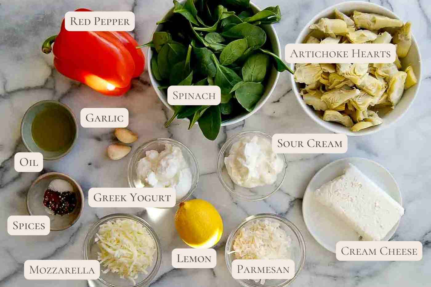 ingredients for spinach and artichoke dip on countertop.