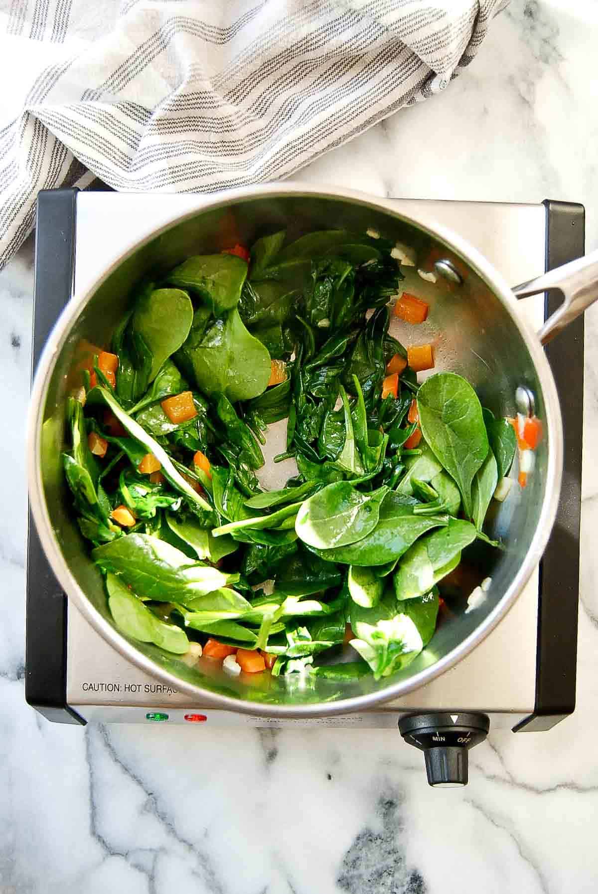 spinach wilting in pan.