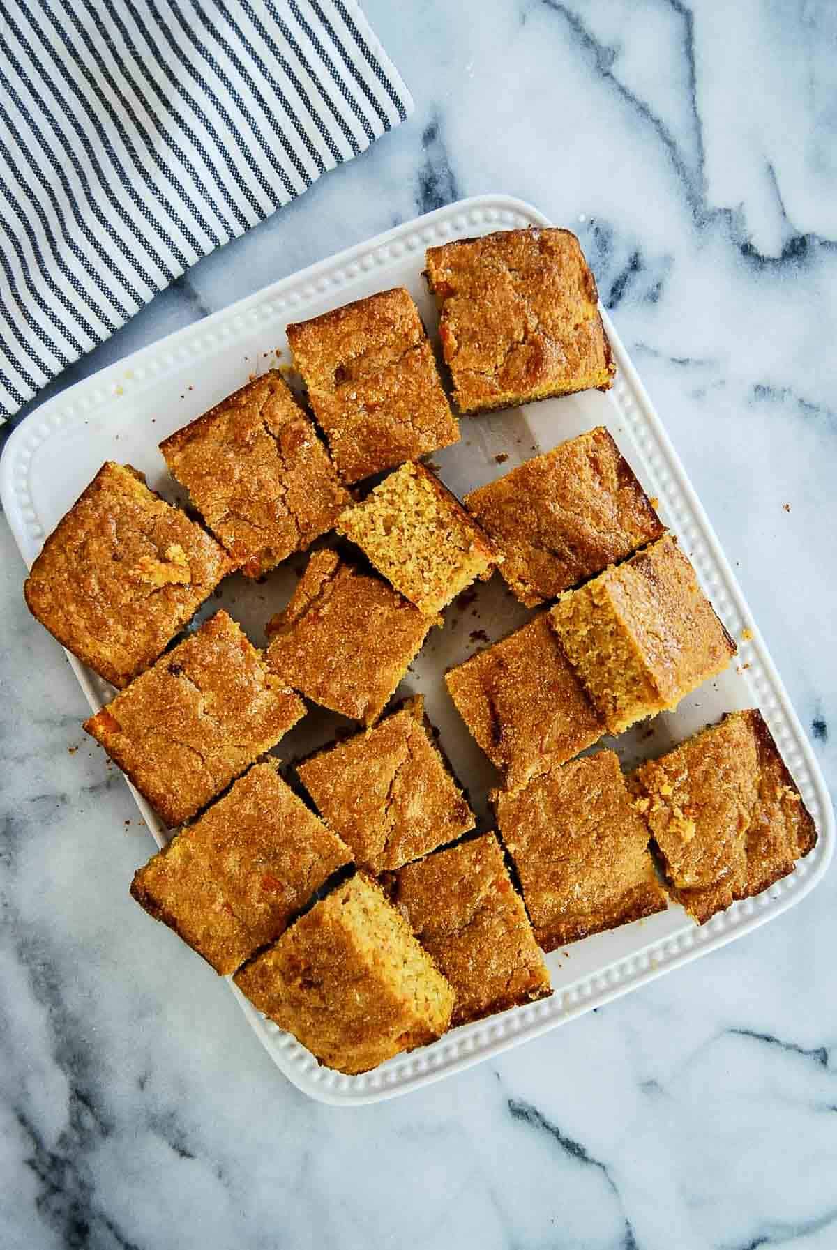 cut squares of sweet potato cornbread on serving platter.
