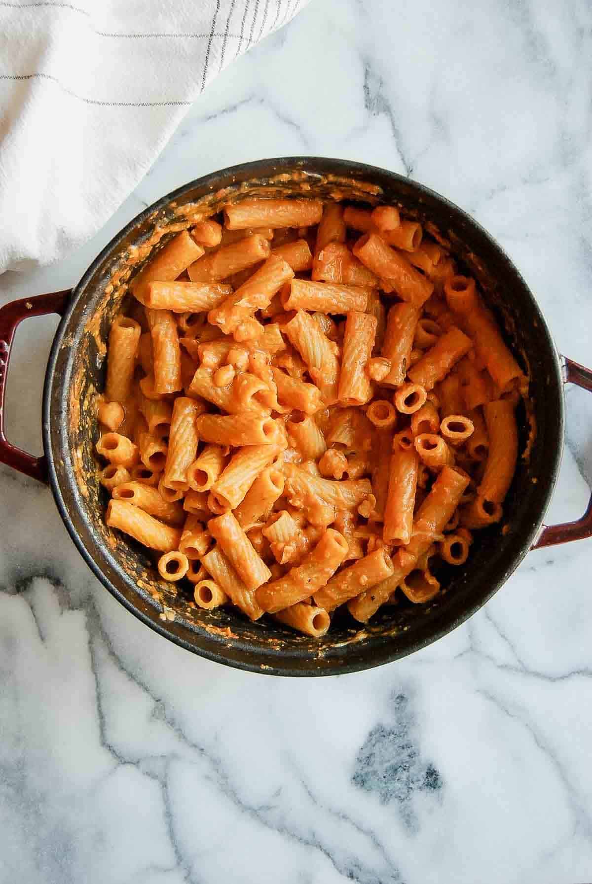 cooked pasta e ceci in dutch oven on countertop.