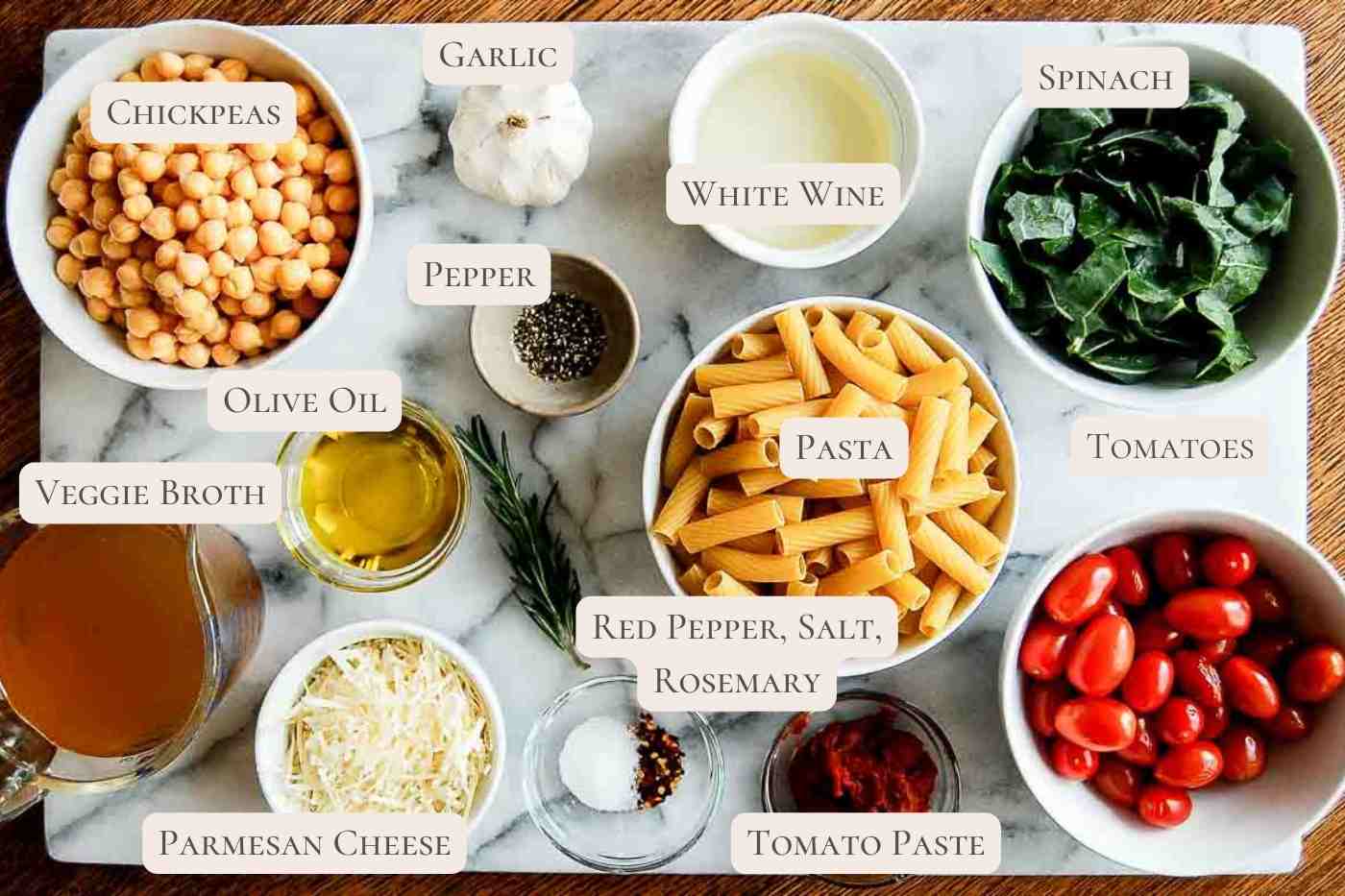 ingredients for pasta with chickpeas on cutting board.