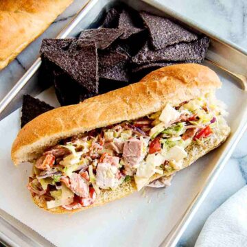 closeup of chopped italian sandwich on tray.