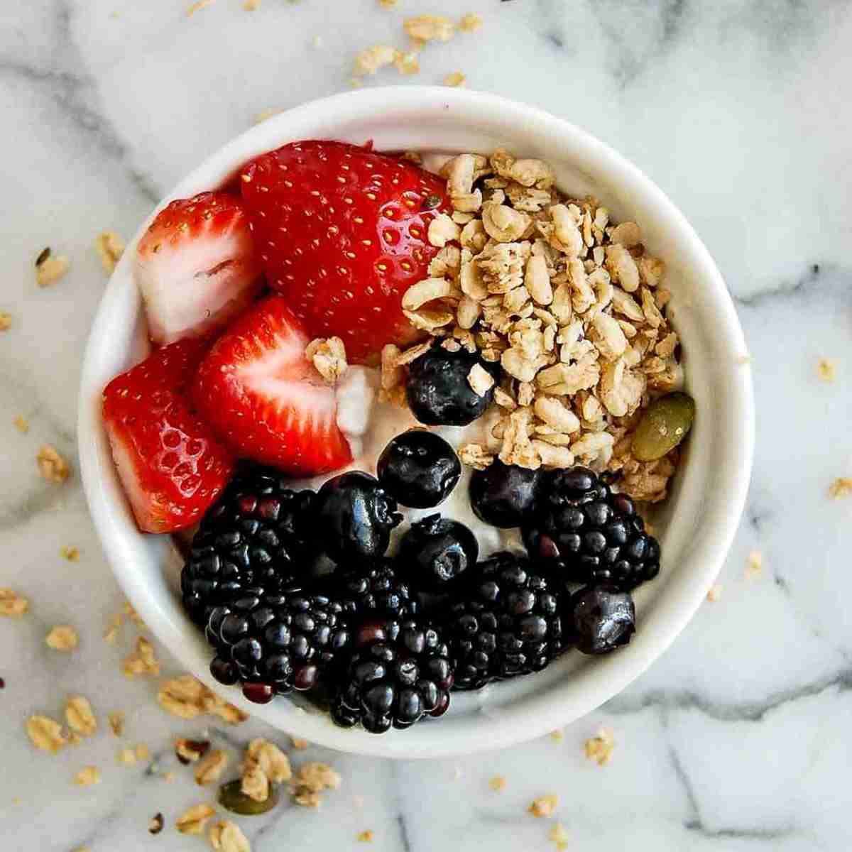 cottage cheese with fruit breakfast bowl on countertop.