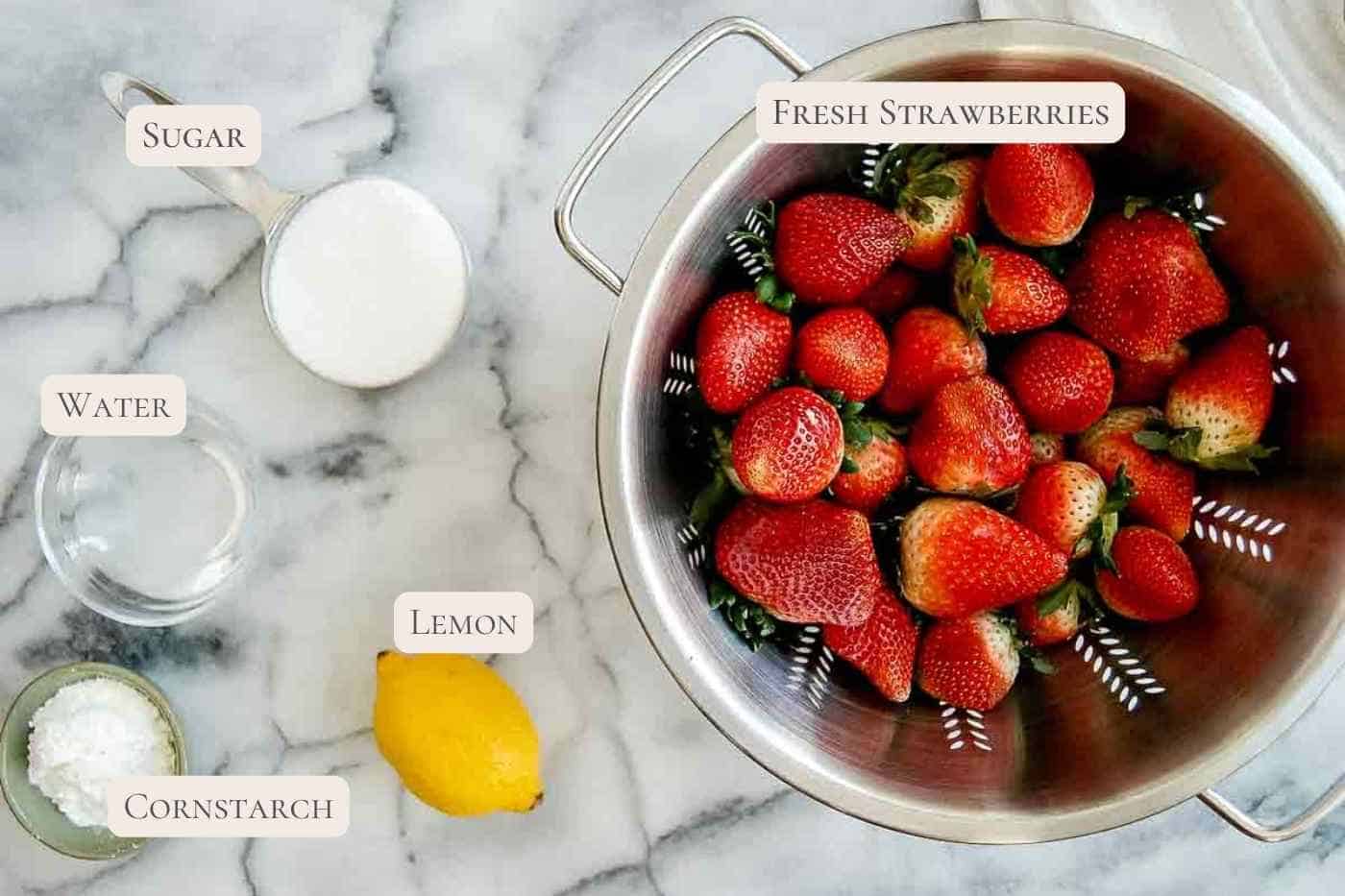 ingredients for strawberry cake filling on countertop.