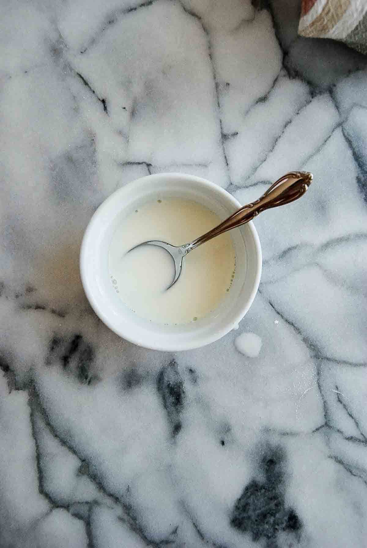 cornstarch slurry in bowl on countertop.