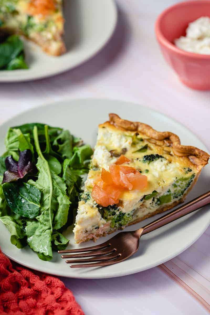 salmon and broccoli quiche on plate.