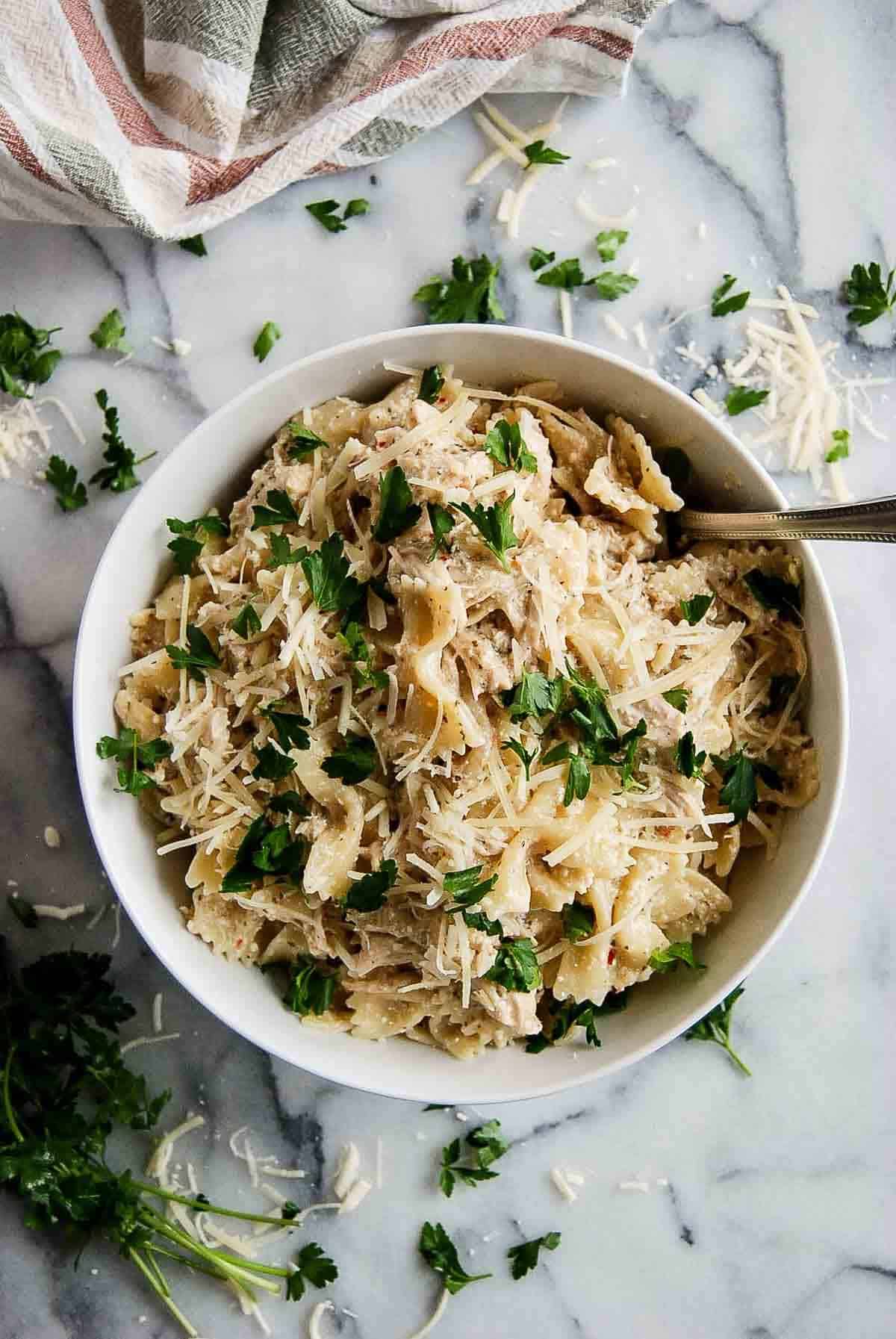 buffalo wild wings garlic parmesan chicken pasta in serving bowl with spoon.