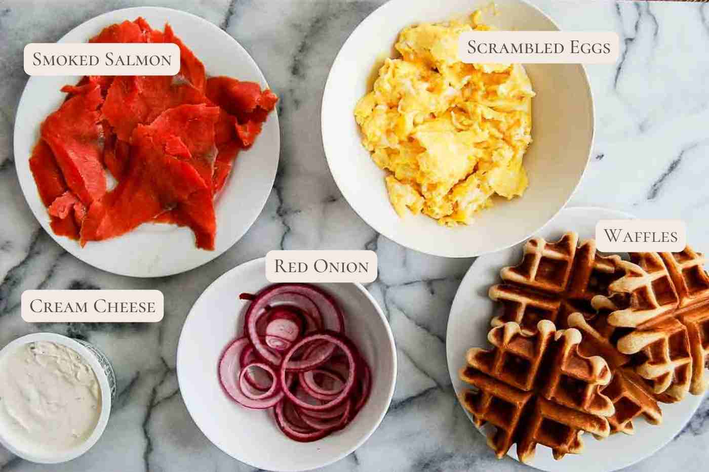 ingredients for waffle breakfast sandwich on countertop.