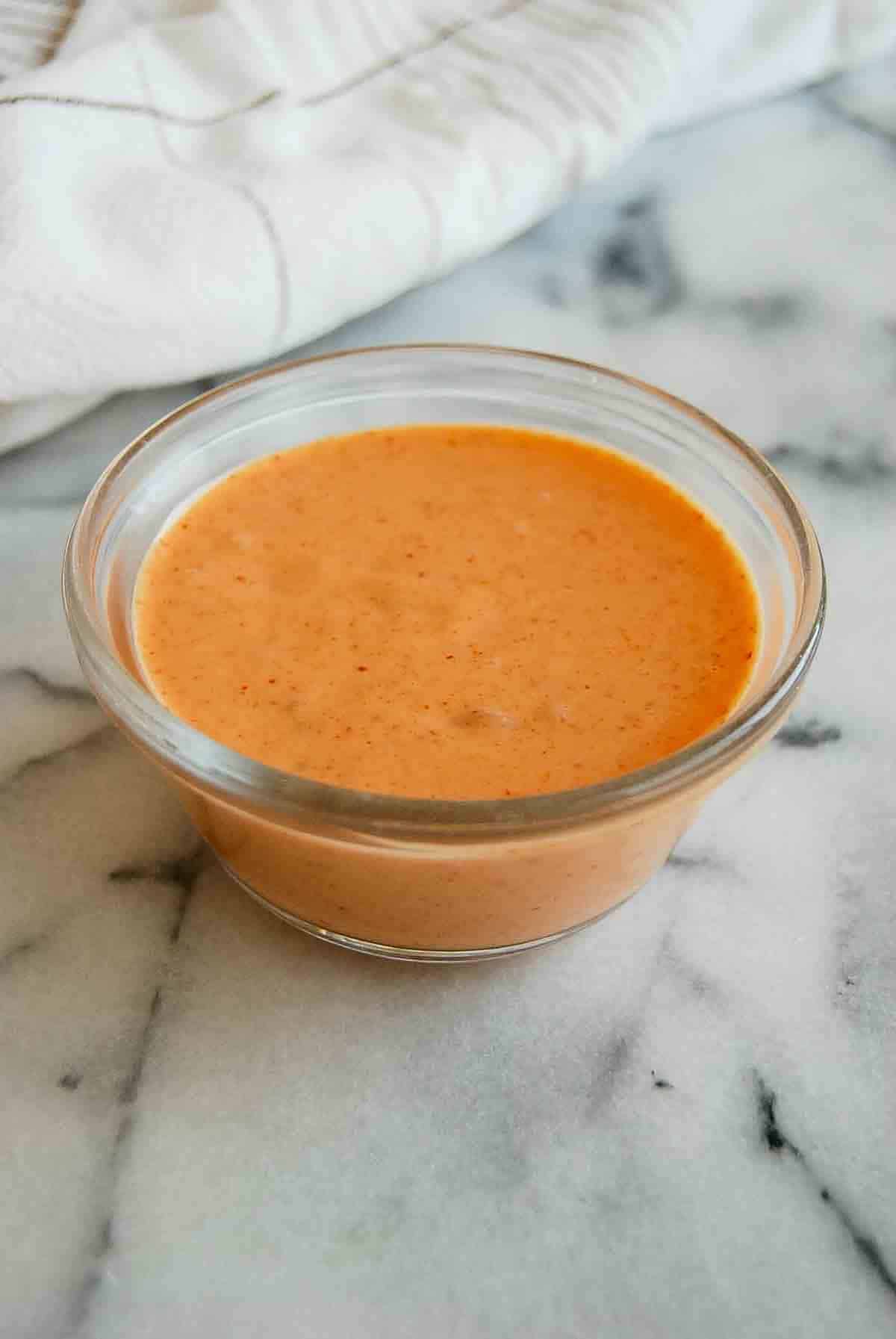 side view of boom boom sauce on countertop.