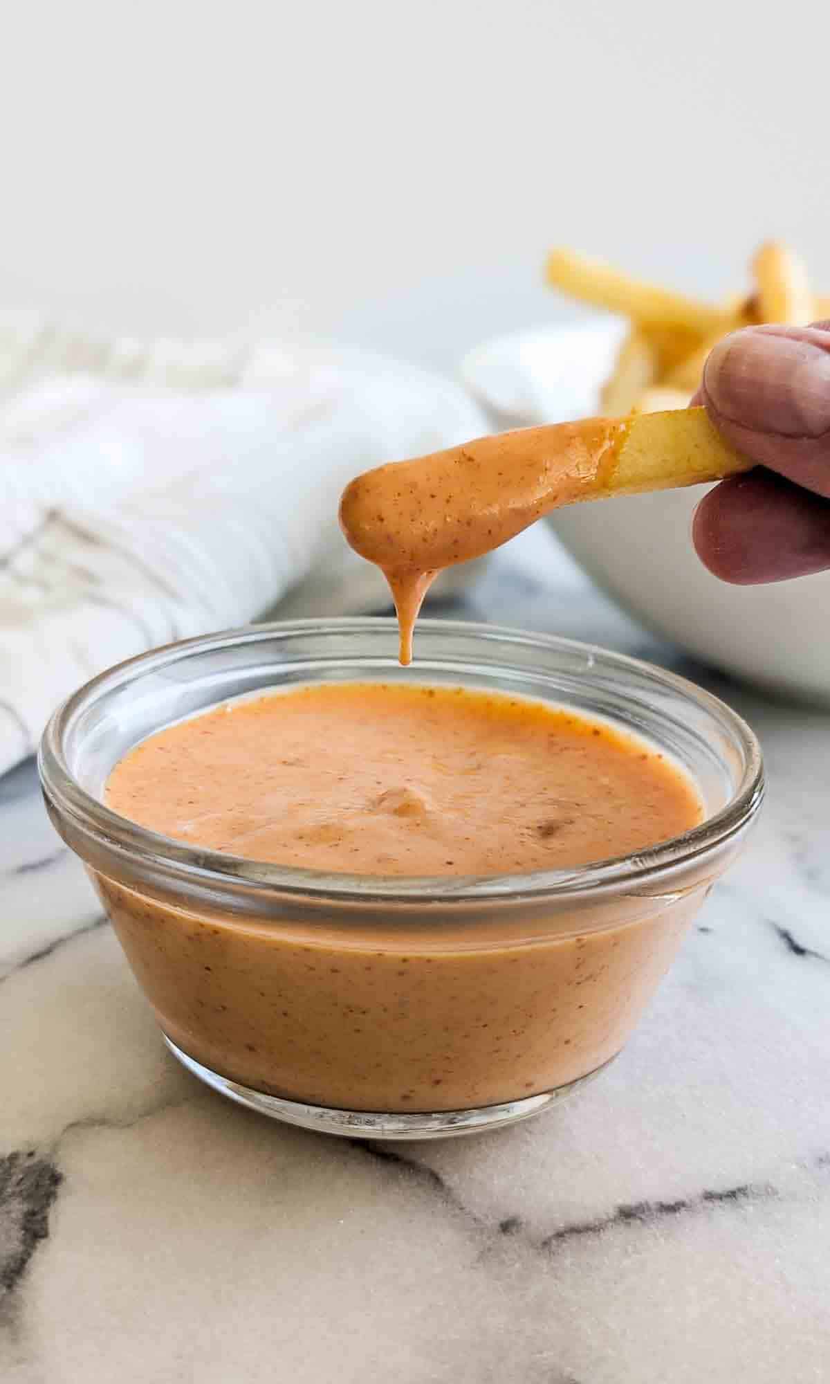 french fry dipped in boom boom sauce.