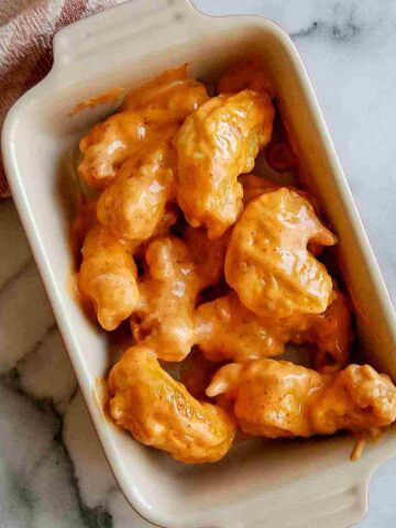 closeup of tempura shrimp in serving bowl on countertop.