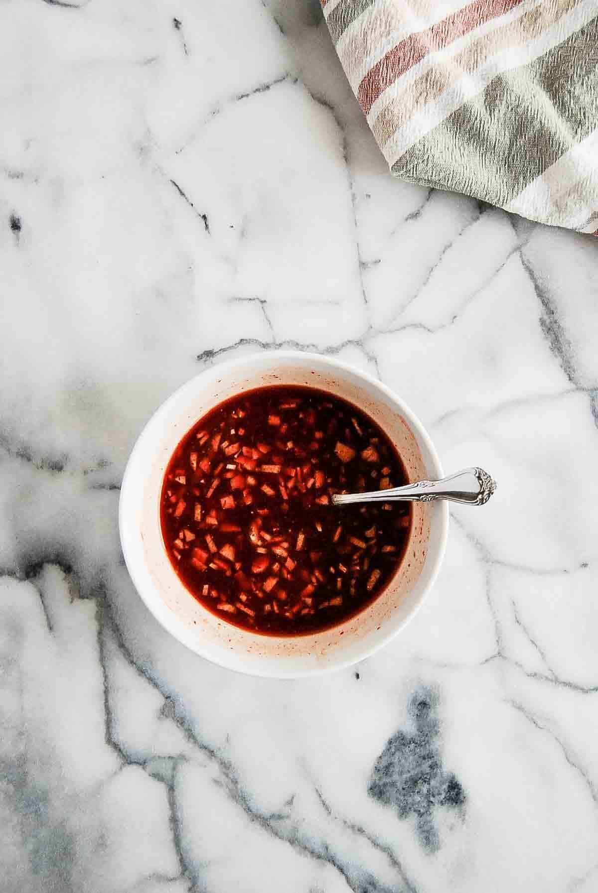 sriracha honey sauce in bowl on countertop.