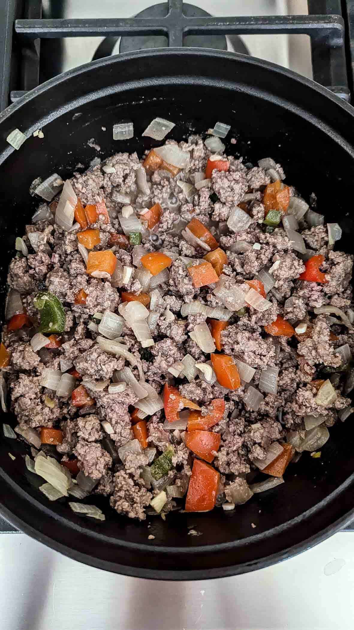 sloppy joe meat mixture in dutch oven on stovetop.