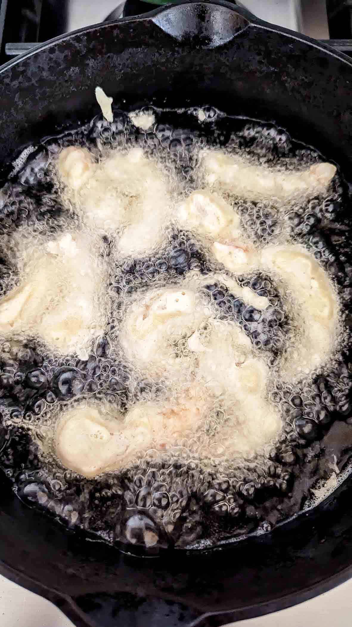 shrimp tempura frying in peanut oil.