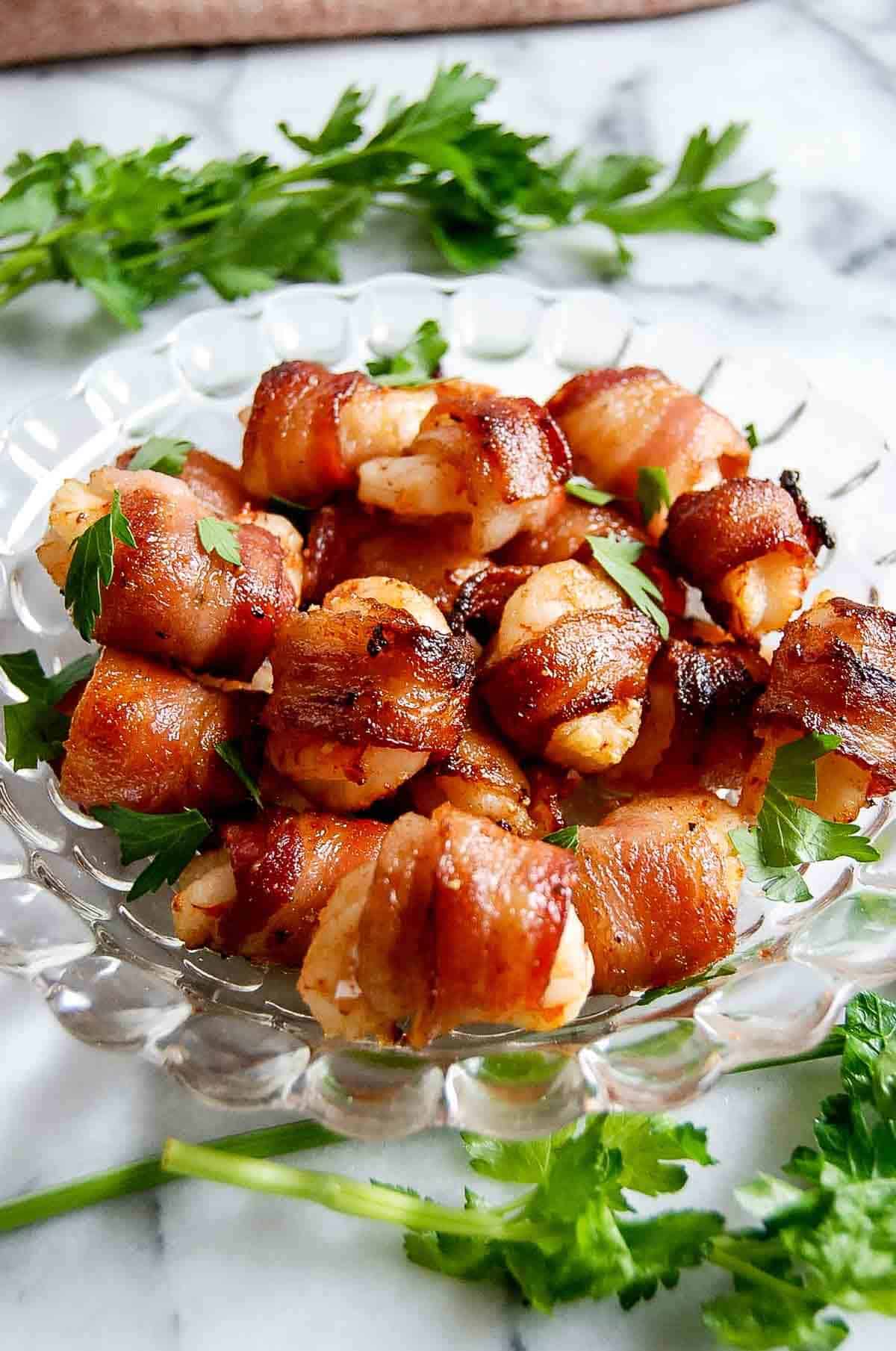 side view of bacon wrapped shrimp from the air fryer.
