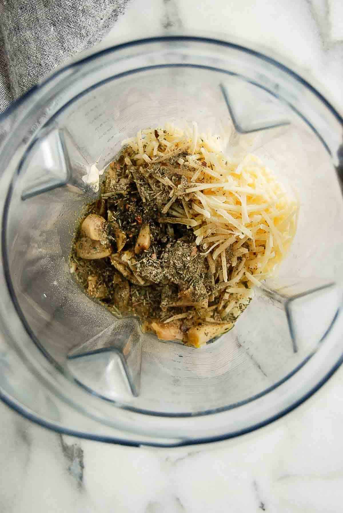 closeup of ingredients for garlic parmesan sauce in blender.