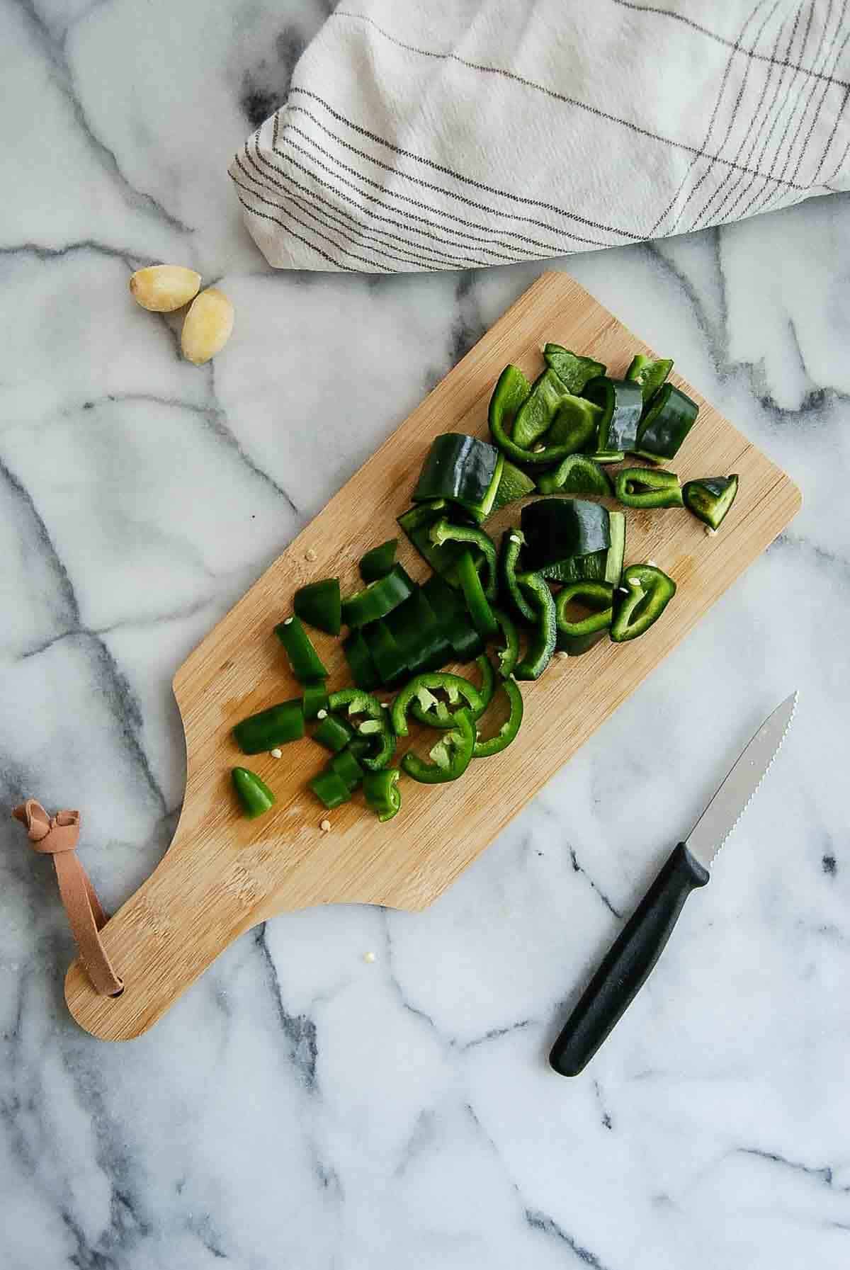 chopped peppers on cutting board.