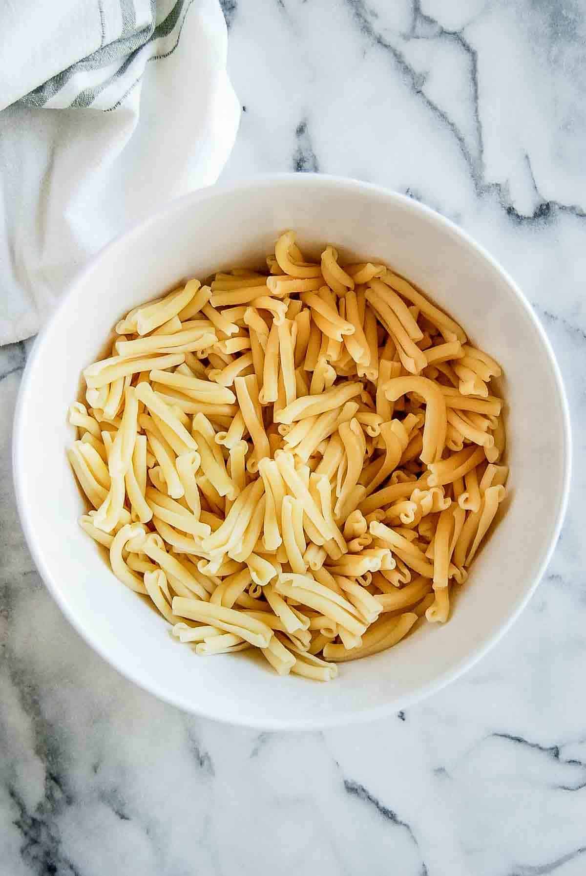 cooked pasta in bowl on countertop.