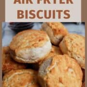 air fryer biscuits piled onto a cutting board.