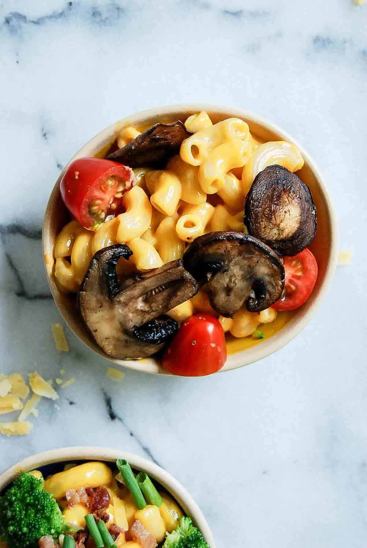 mac and cheese with mushrooms and tomatoes.