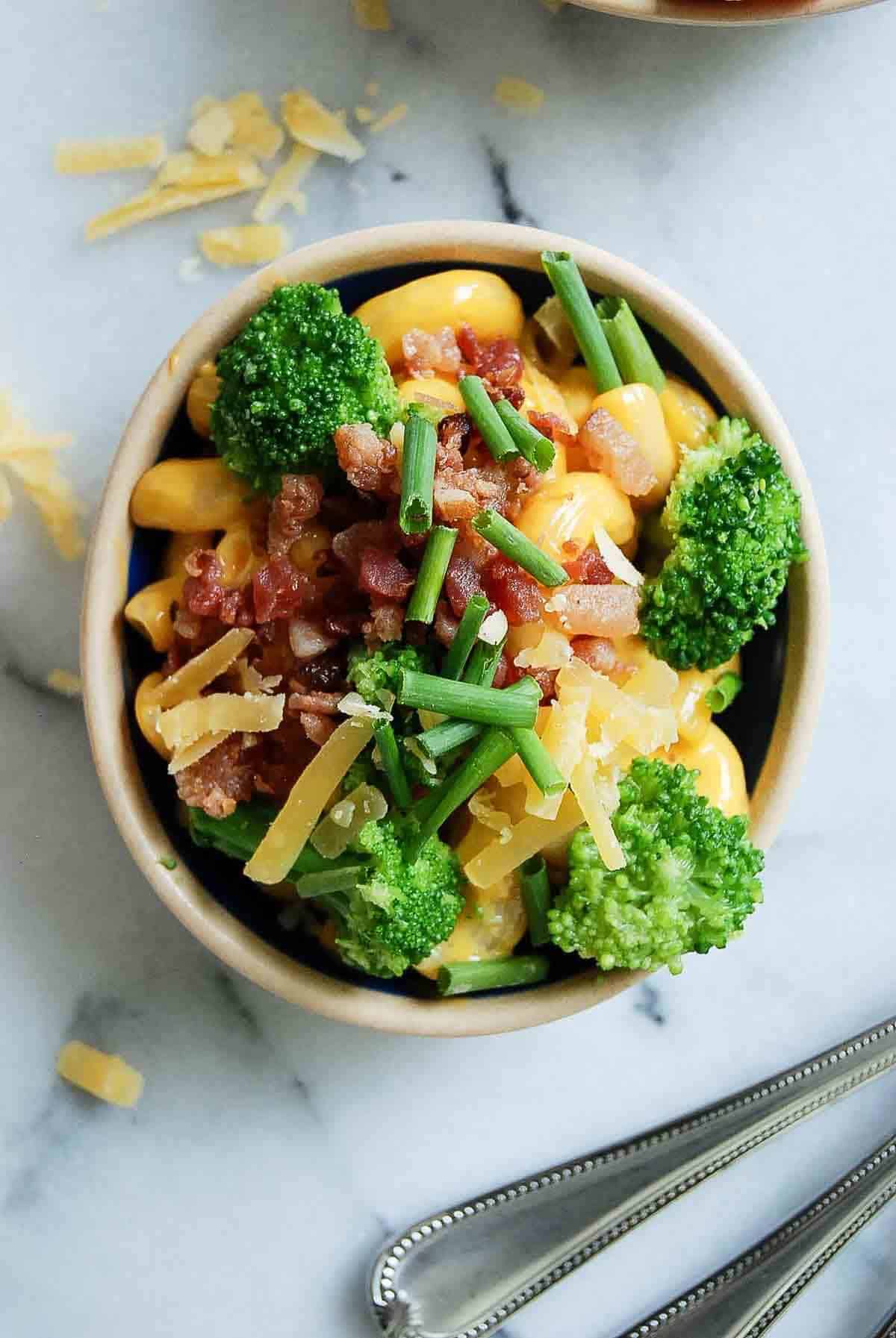 mach and cheese with broccoli, bacon, gouda and gruyere cheese.