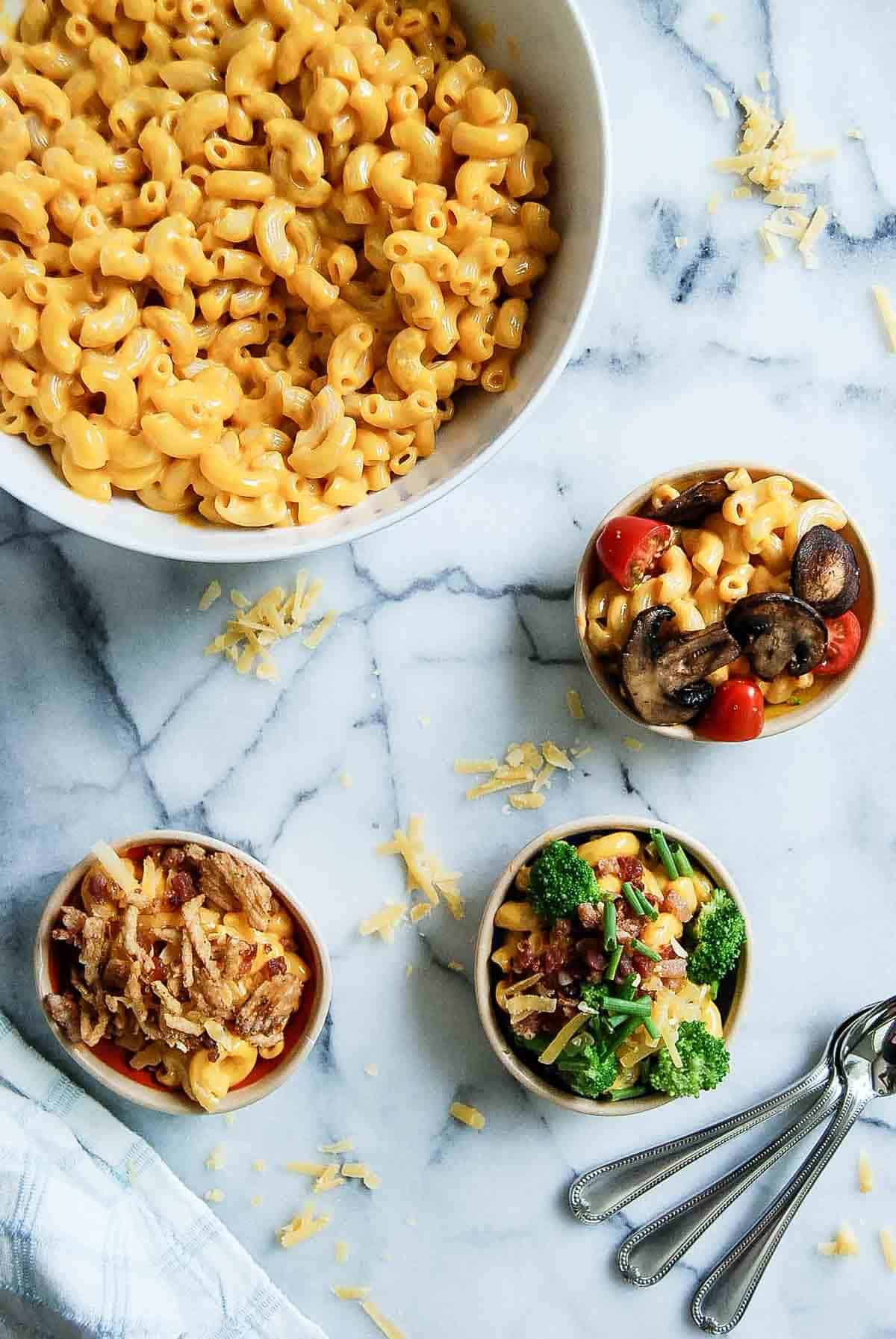 mac and cheese bar bowl with three variations of toppings.
