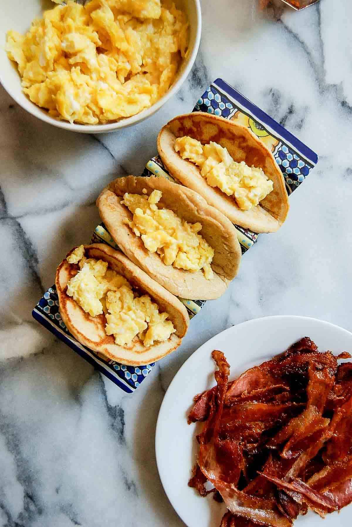 pancake tacos filled with creamy scrambled eggs.