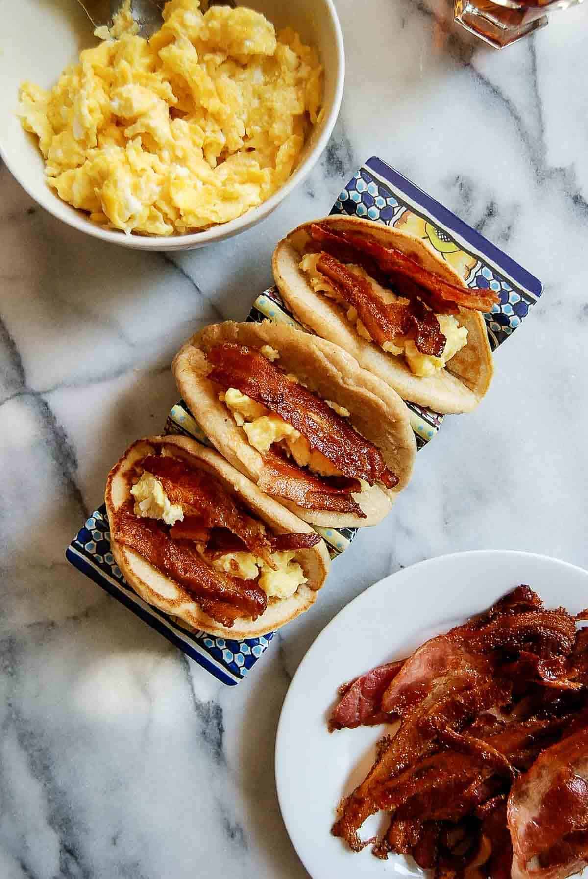 pancake tacos with eggs and bacon.