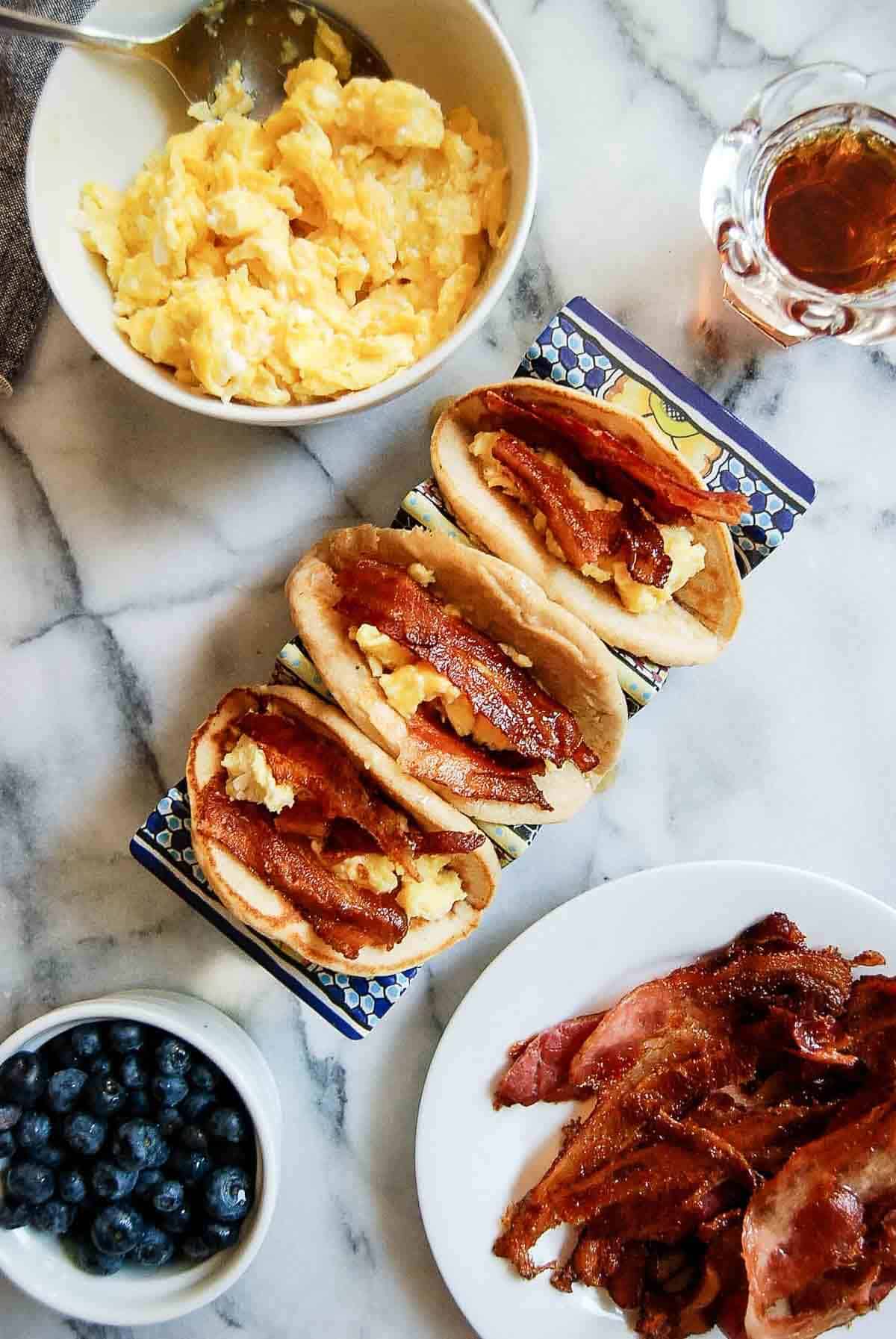 pancake tacos with bacon, eggs and maple syrup.