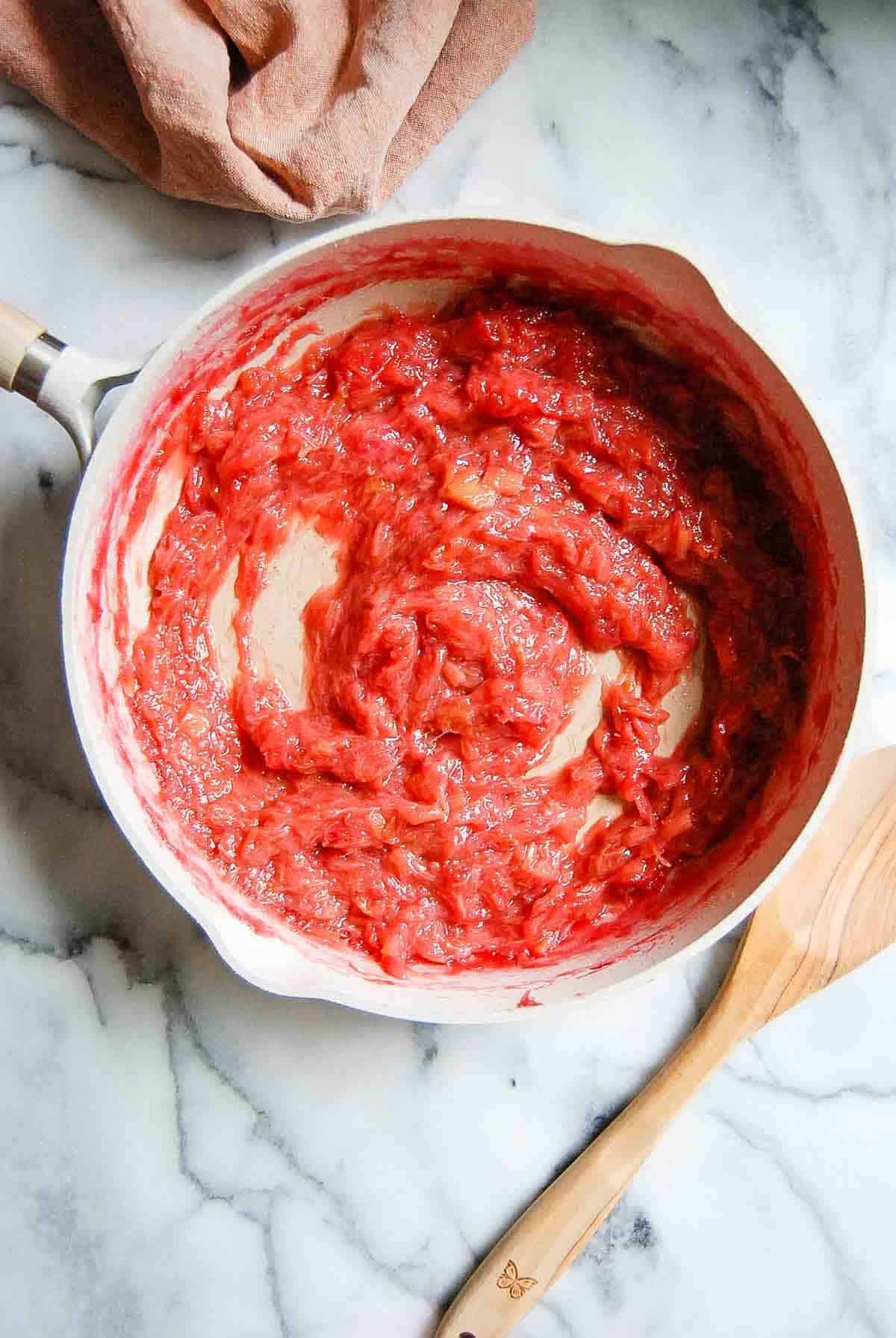 cooked rhubarb sauce in saucepan.