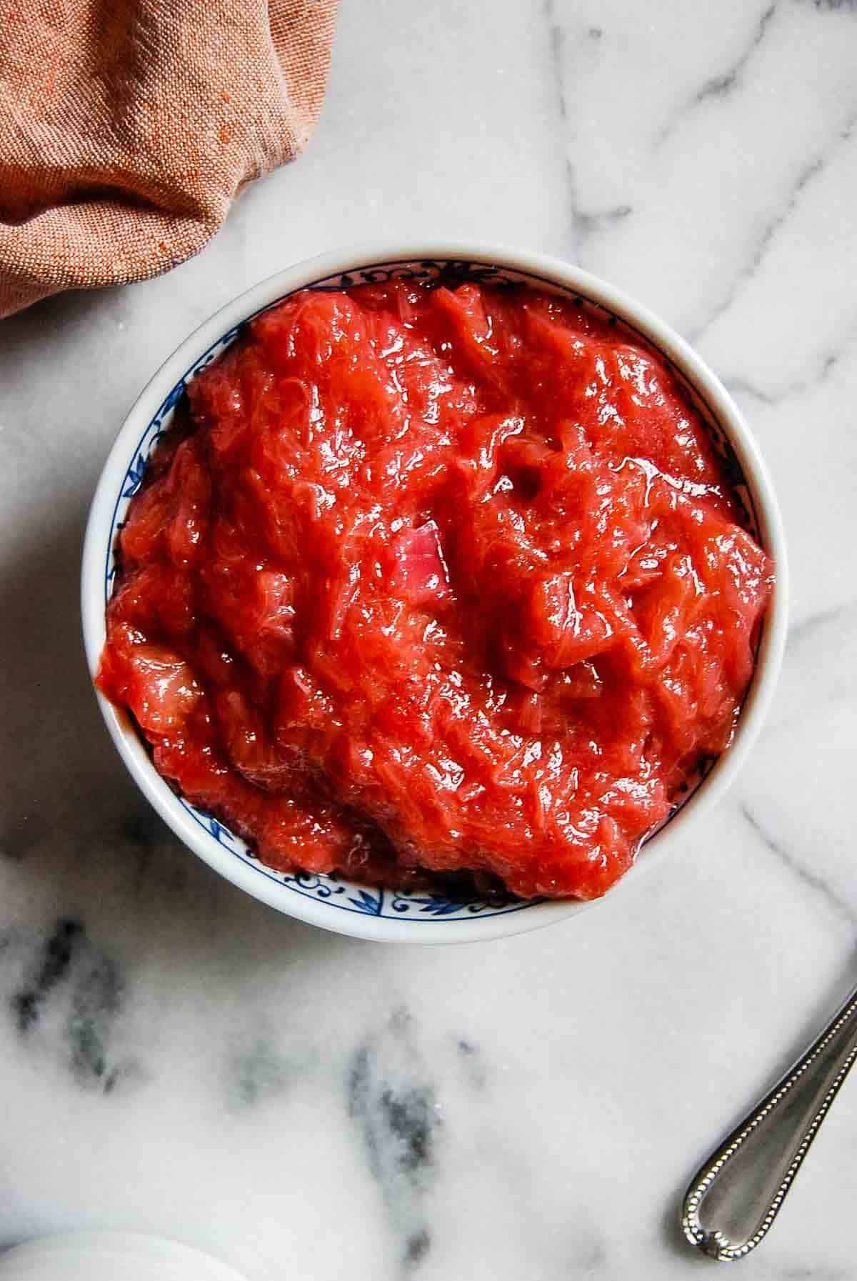 bowl of rhubarb sauce on countertop.