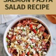 healthy salmon pasta salad in bowl on countertop.
