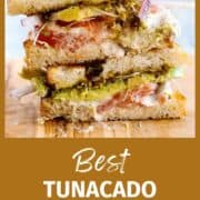 tunacado sandwich, stacked on cutting board.