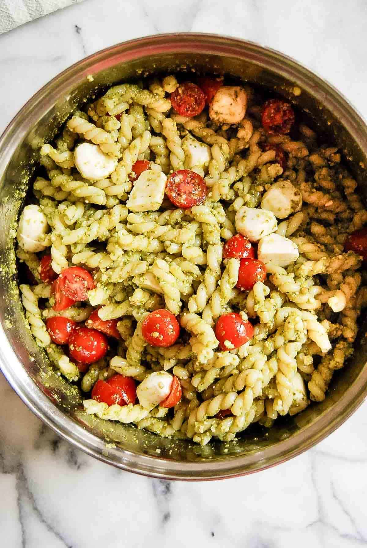 4 ingredient pesto pasta salad in pot on countertop.