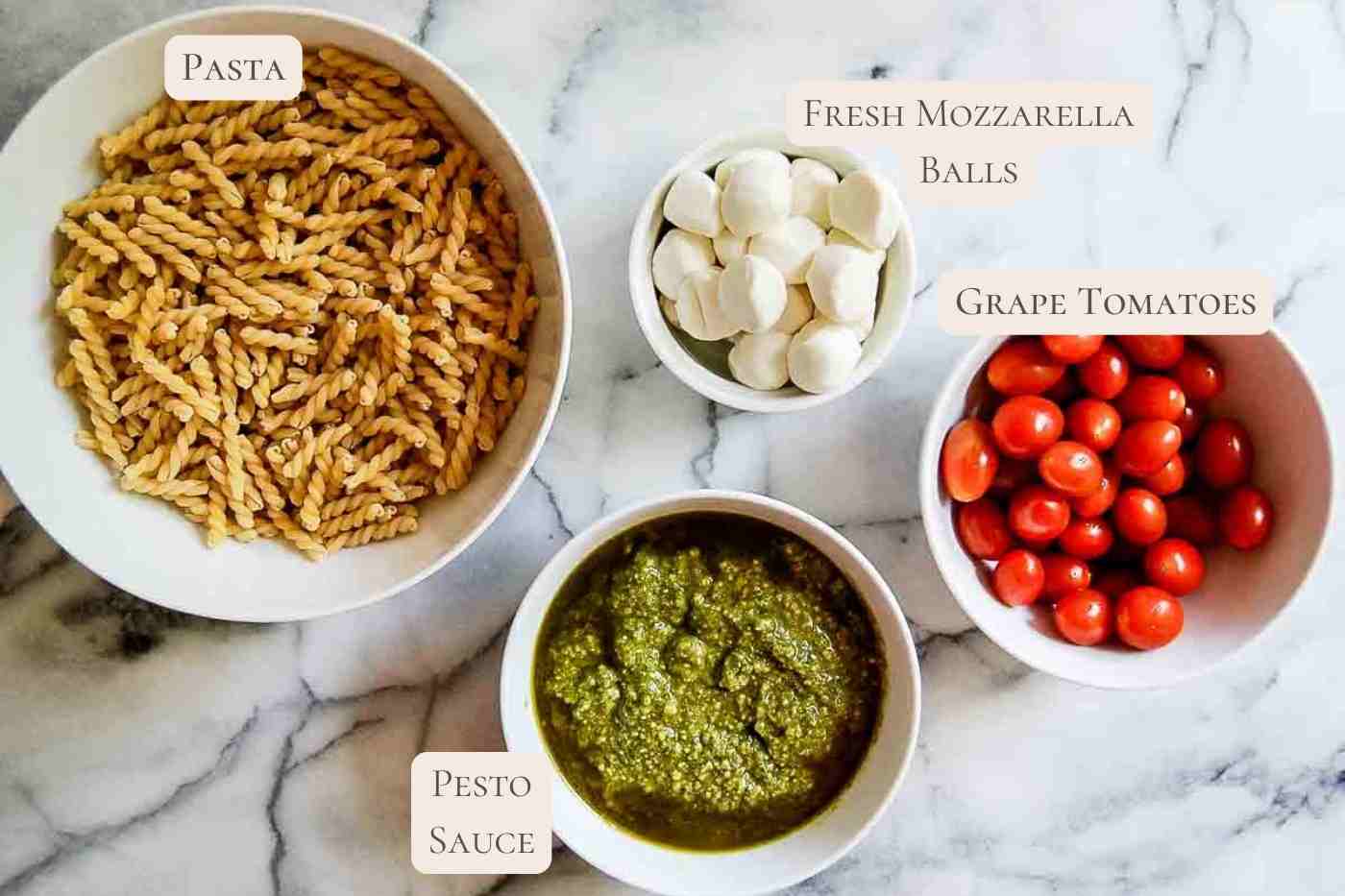 ingredients for four ingredient pasta salad on countertop, labeled.