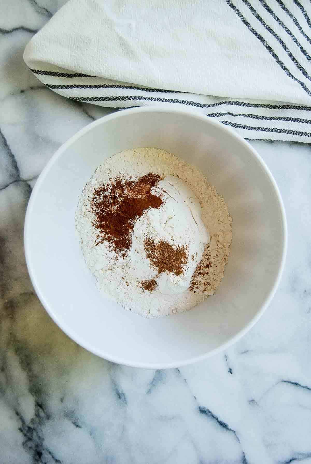 cake mix in bowl, with cinnamon and nutmeg added in.