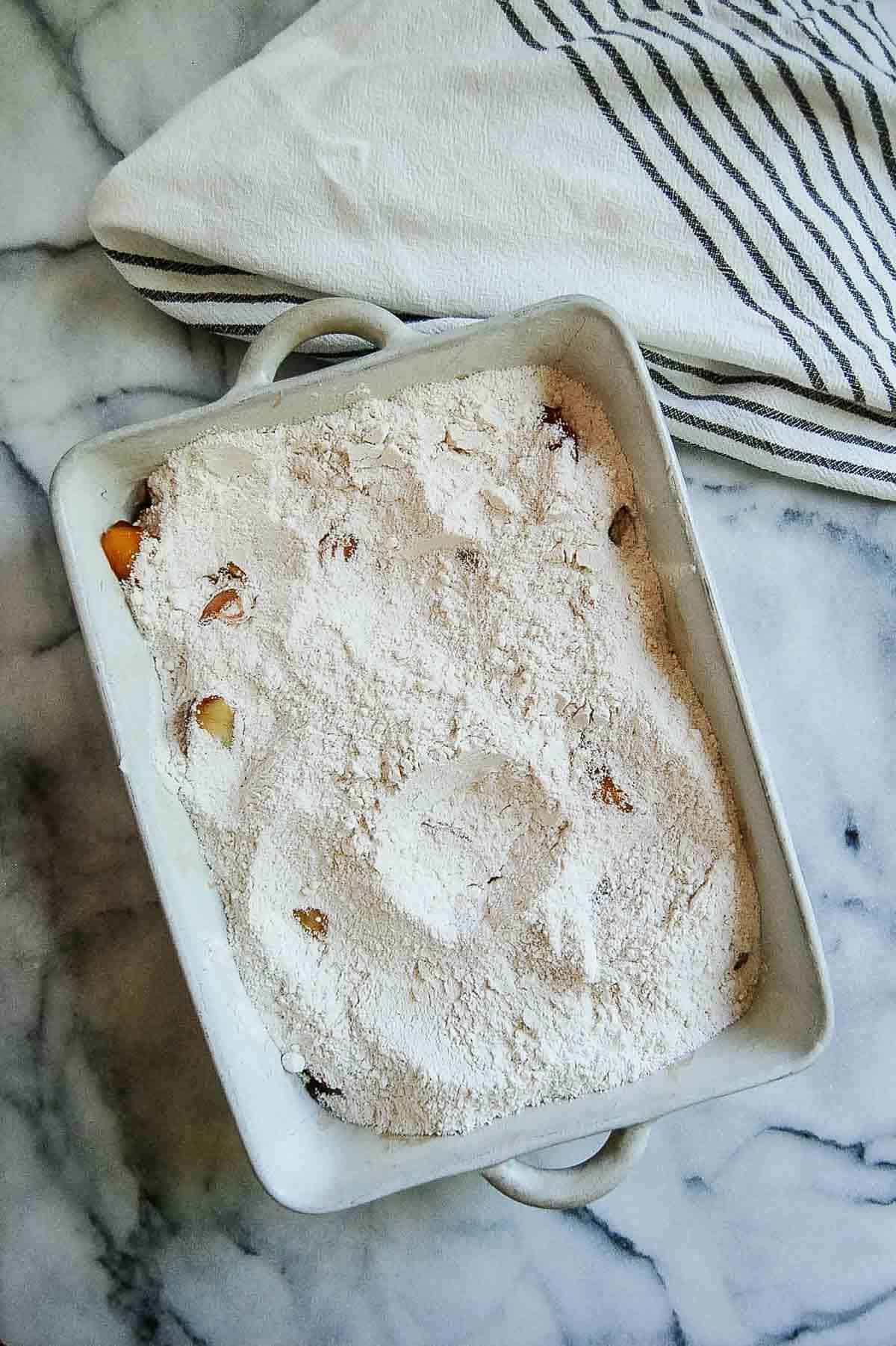peaches topped with boxed cake mix.