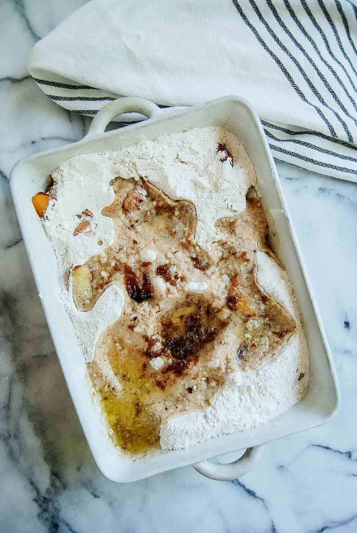 melted butter poured over peaches and cake mix.